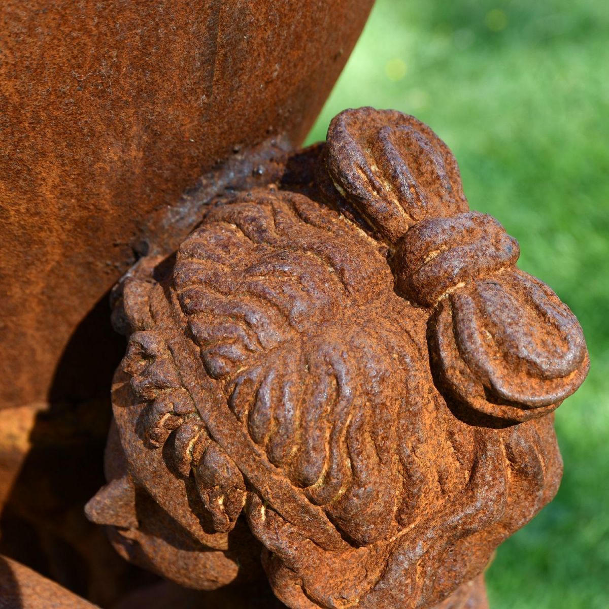 Close up of Hair and Bow on Cast Iron Statue