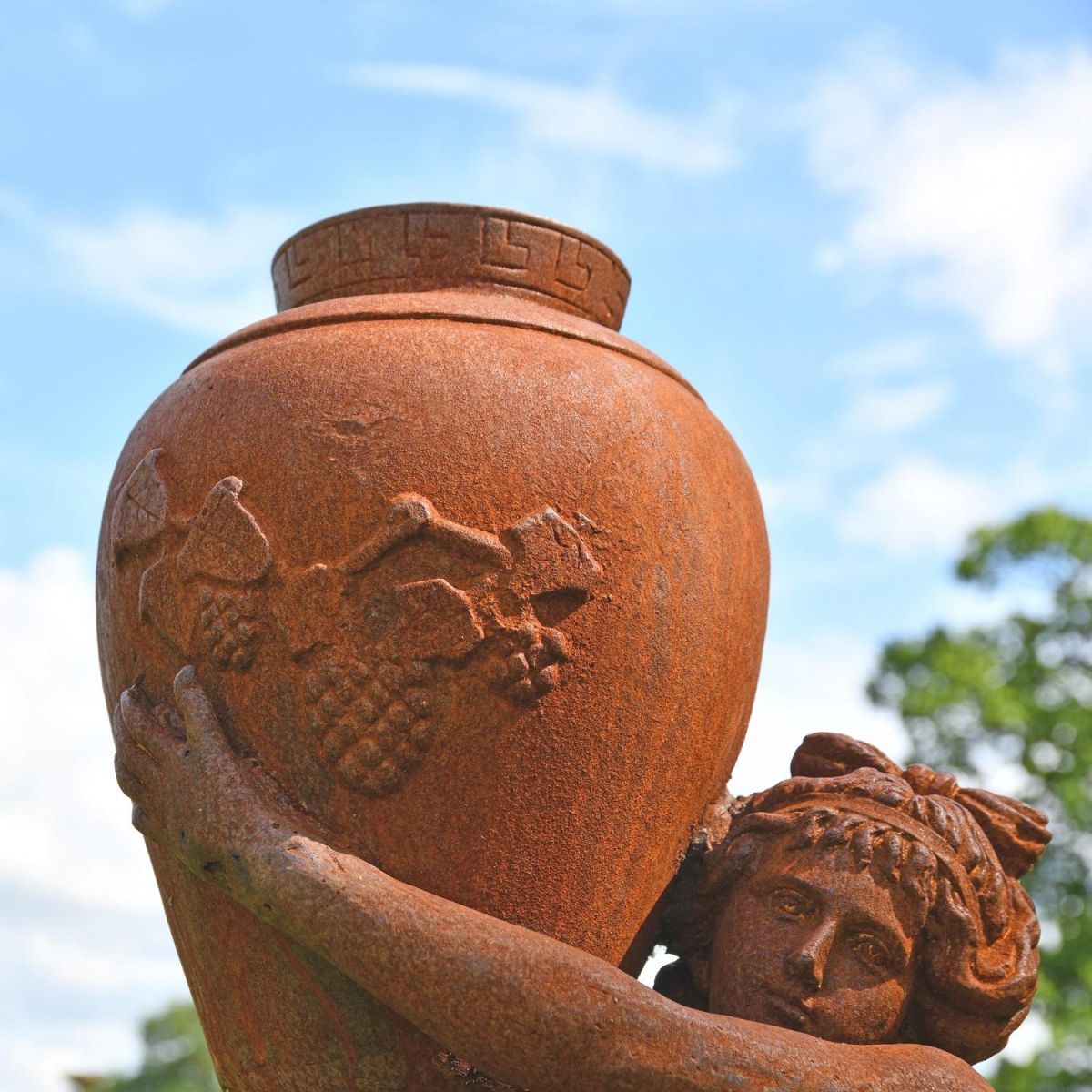Close up of Cast Iron Vase & Greek Lady with Grape detailing