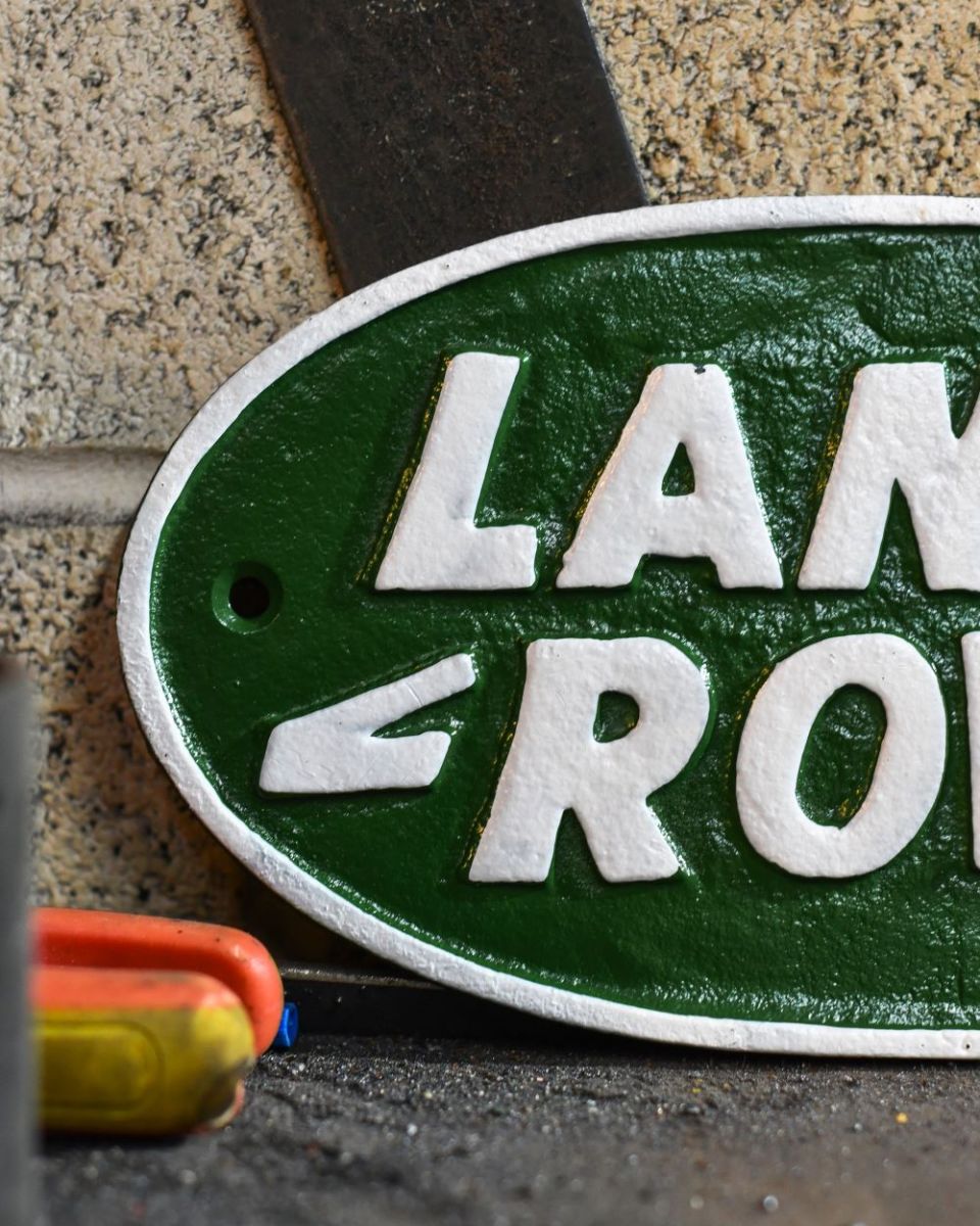 Close up of Green Land Rover Vintage Style Cast Iron Sign finish