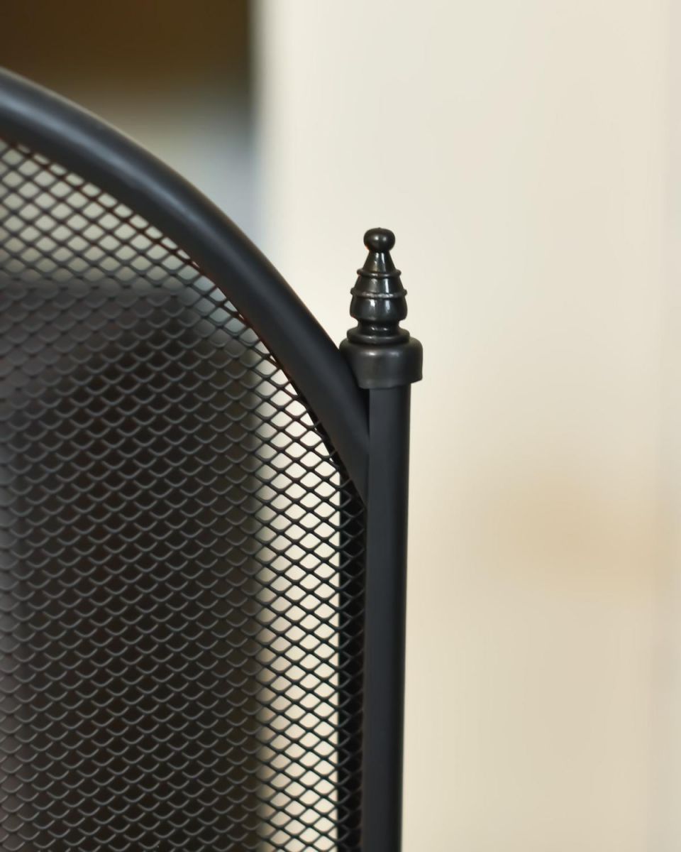 Close Up Of Large Black Four Fold Fire Guard Finials