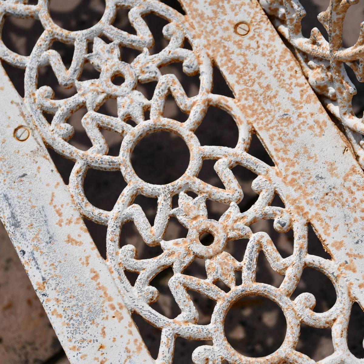 Close up of detailing on cast iron garden bench Close up of detailing on cast iron garden bench