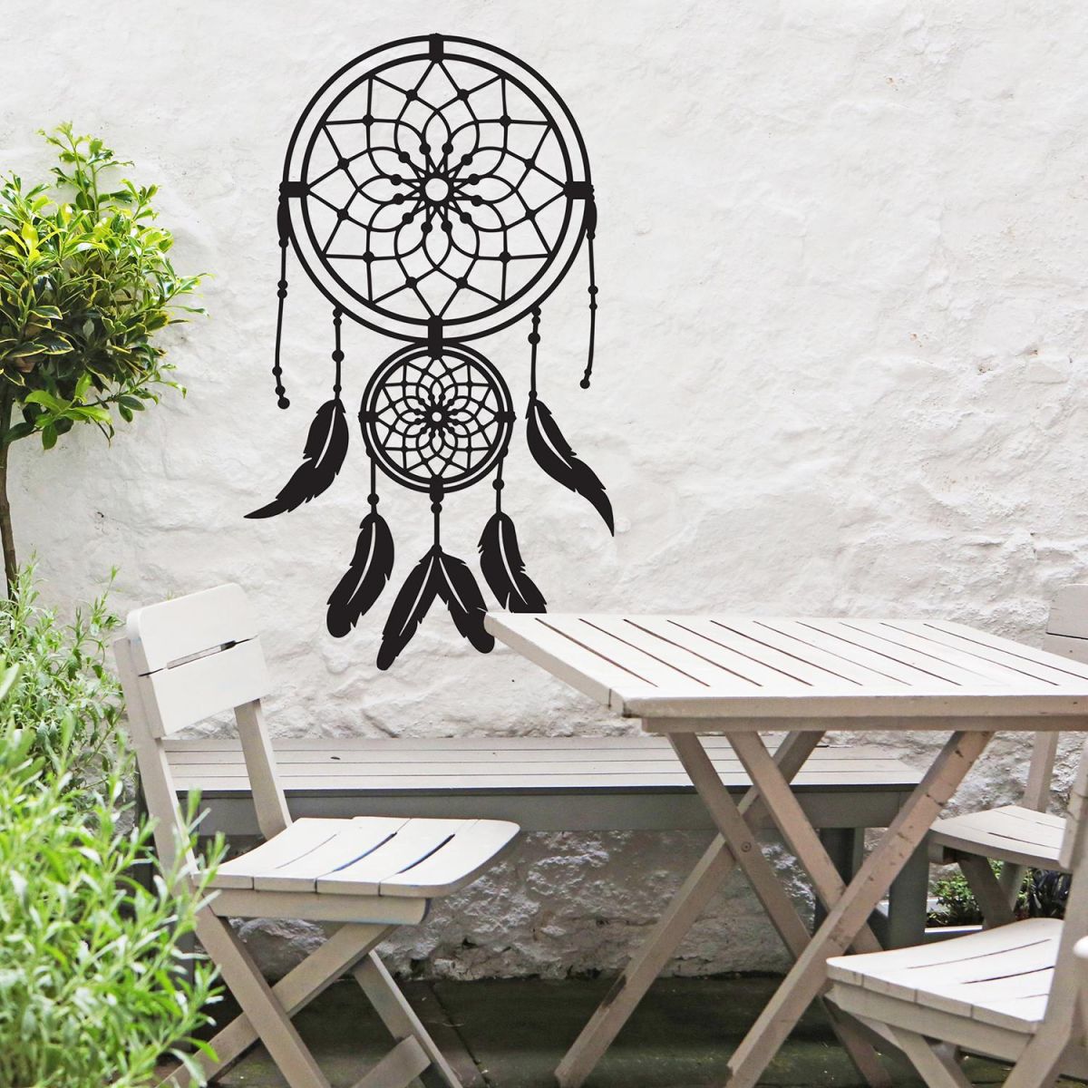 Dream Catcher Steel Wall Art in Situ in the Garden by a Wooden Furniture Set Dream Catcher Steel Wall Art in Situ in the Garden by a Wooden Furniture Set