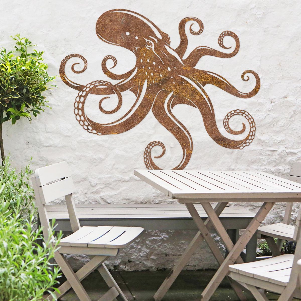 Octopus Rustic Wall Art in the Garden Above a Wooden Table & Chair Set
