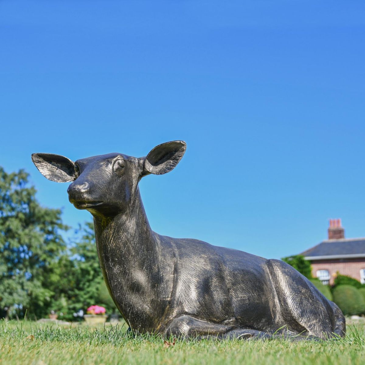 Large Recycled Cast Aluminium Brushed Gold Lying Doe Sculpture in Situ