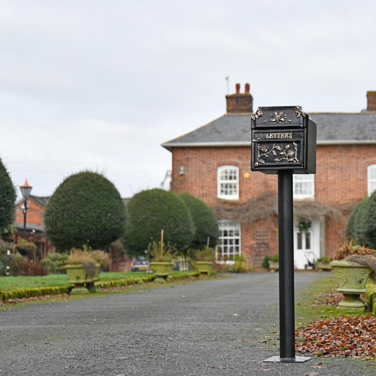 "Balmoral Rosette" Post Box in front of home 