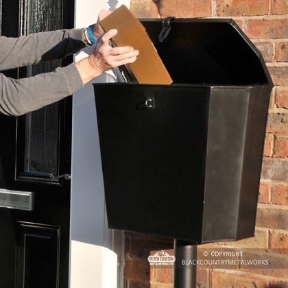 Medium Size Parcel Being Put into the "Billingsgate" Large Secure Parcel Box  Medium Size Parcel Being Put into the "Billingsgate" Large Secure Parcel Box