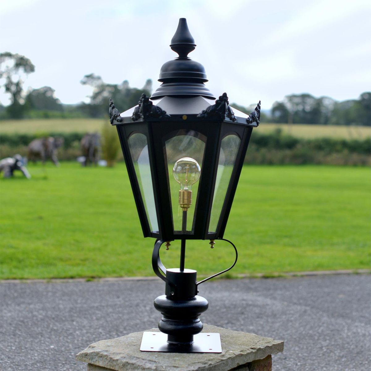 Black Hexagonal Pillar Light and Lantern Set in Situ on a Driveway
