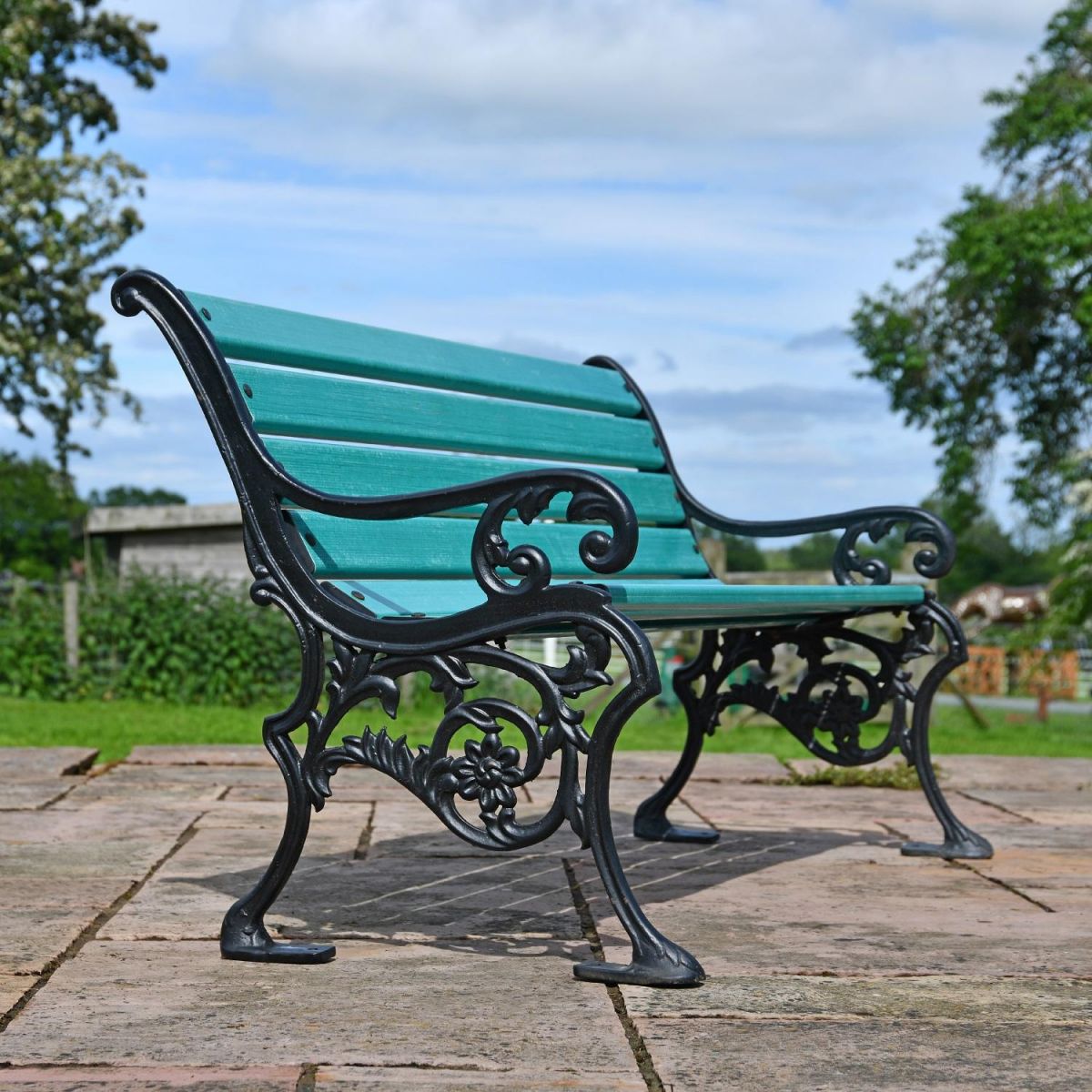 Side view of Ornate Green Cast Iron Garden Bench