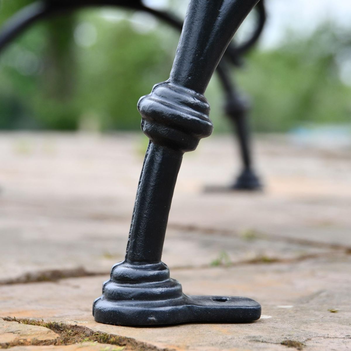 Close up of cast iron leg on garden bench 