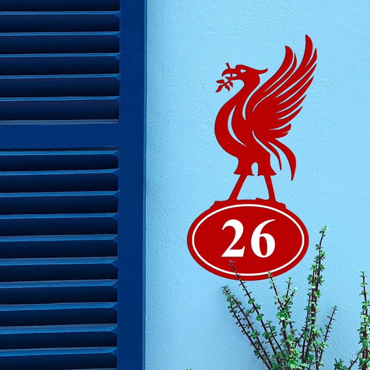 Liver Bird Iron House Number Sign in Situ on a Blue Wall 