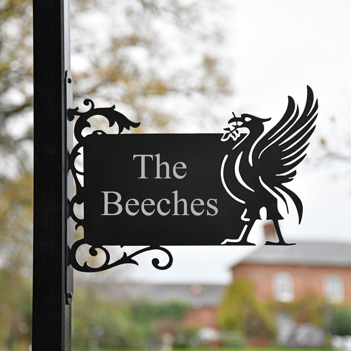 Liver Bird Wall Bracketed House Name Sign in Situ in a Front Garden