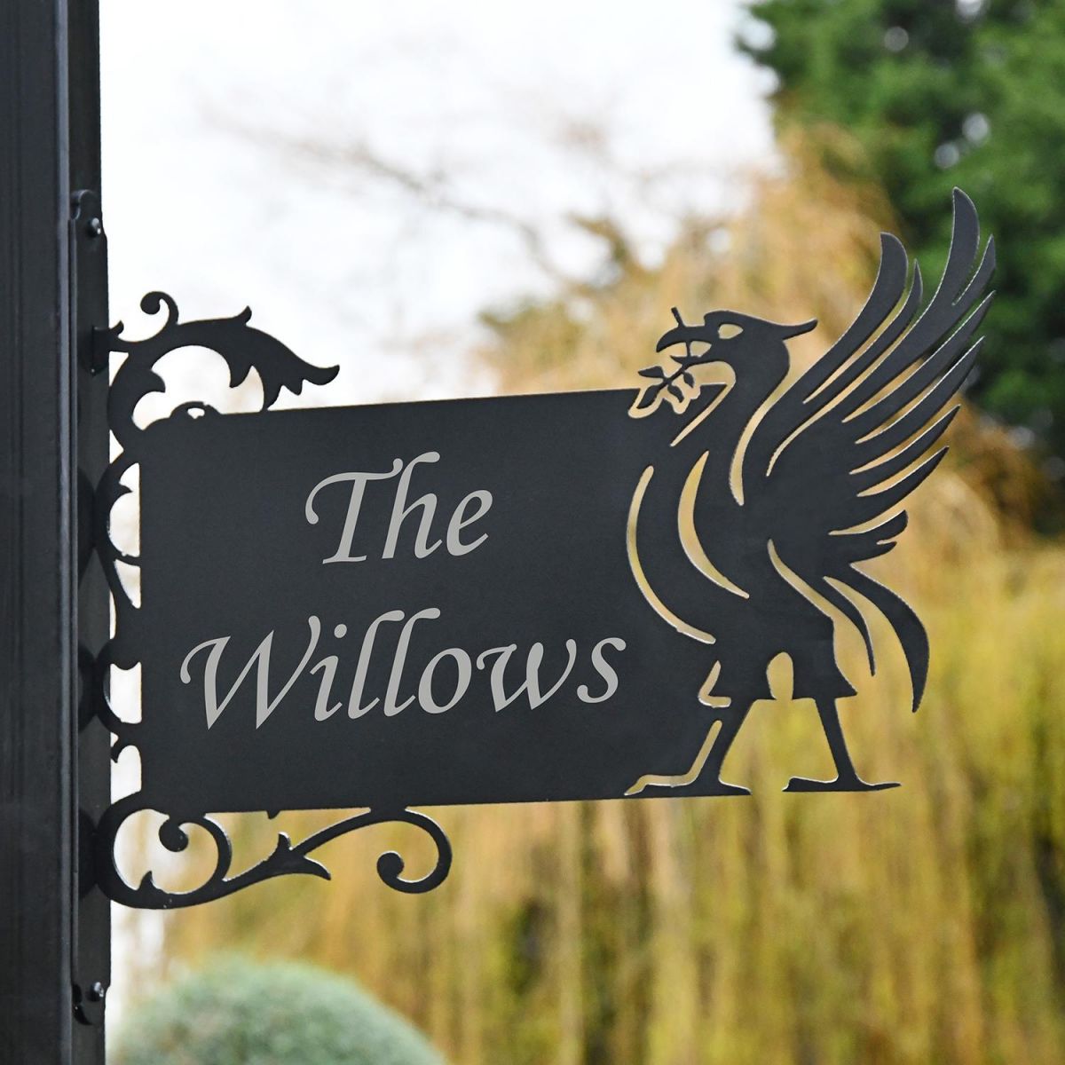 Liver Bird Wall Bracketed House Name Sign in a Front Garden