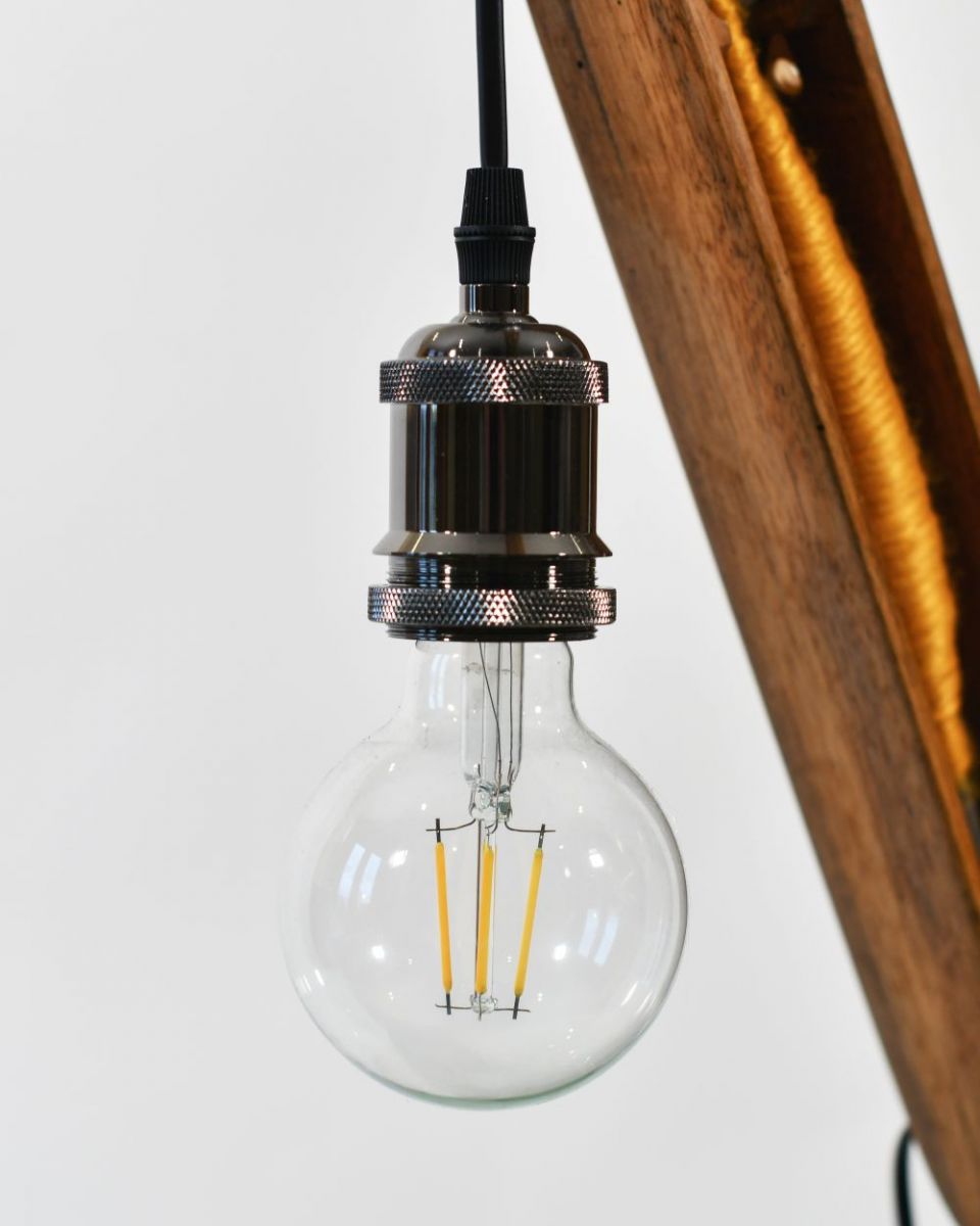 Close up of Yellow Loom Bobbin Table Lamp Bulb Close up of Yellow Loom Bobbin Table Lamp Bulb