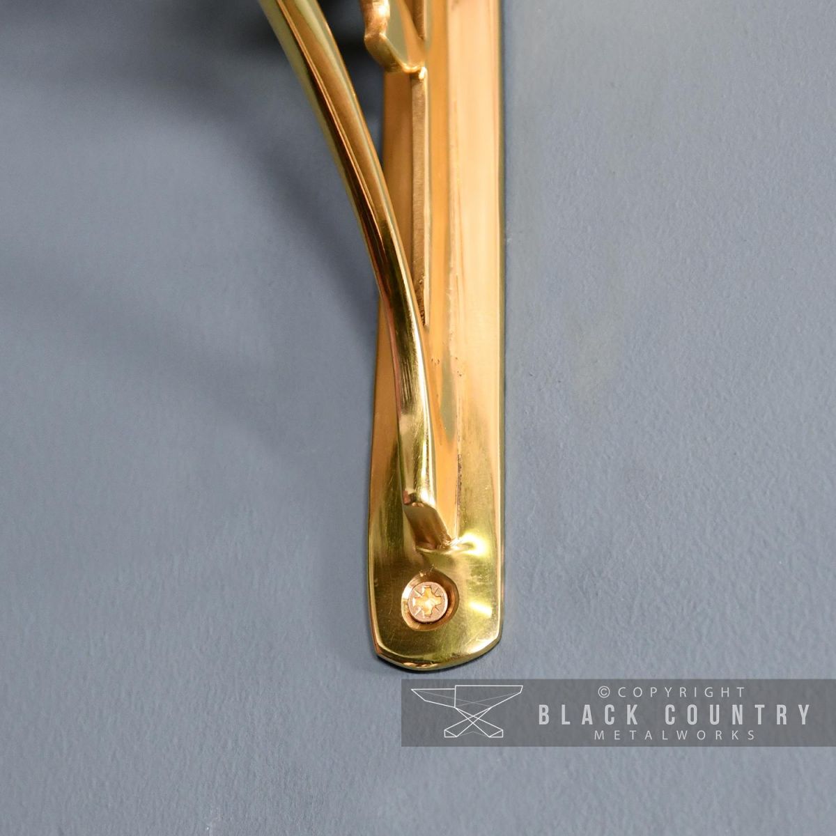 Close-up of the fixing Holes on the "Lotus Flower" Brass Shelf Bracket