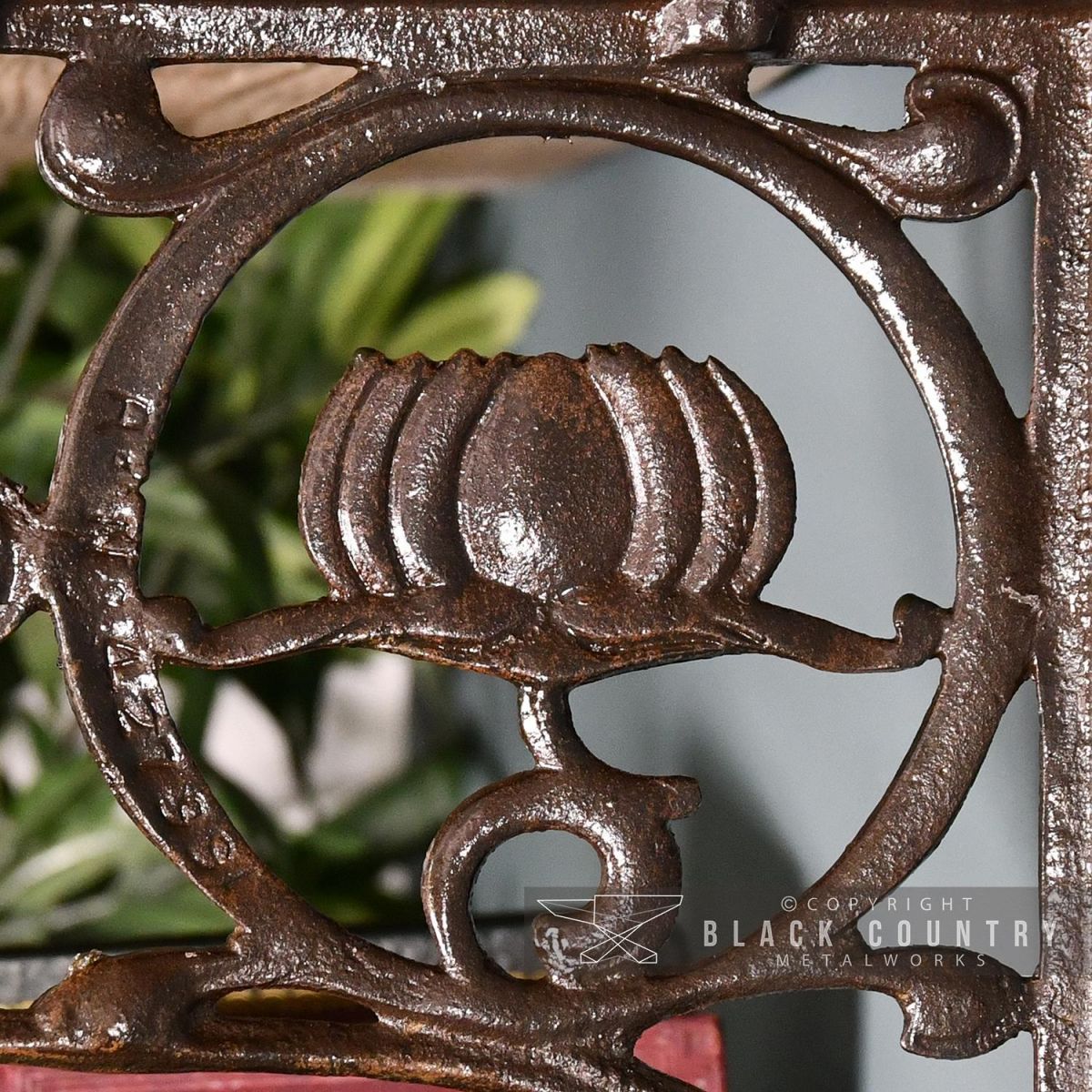Close-up of the "Lotus Flower" Design on the Iron Shelf Bracket