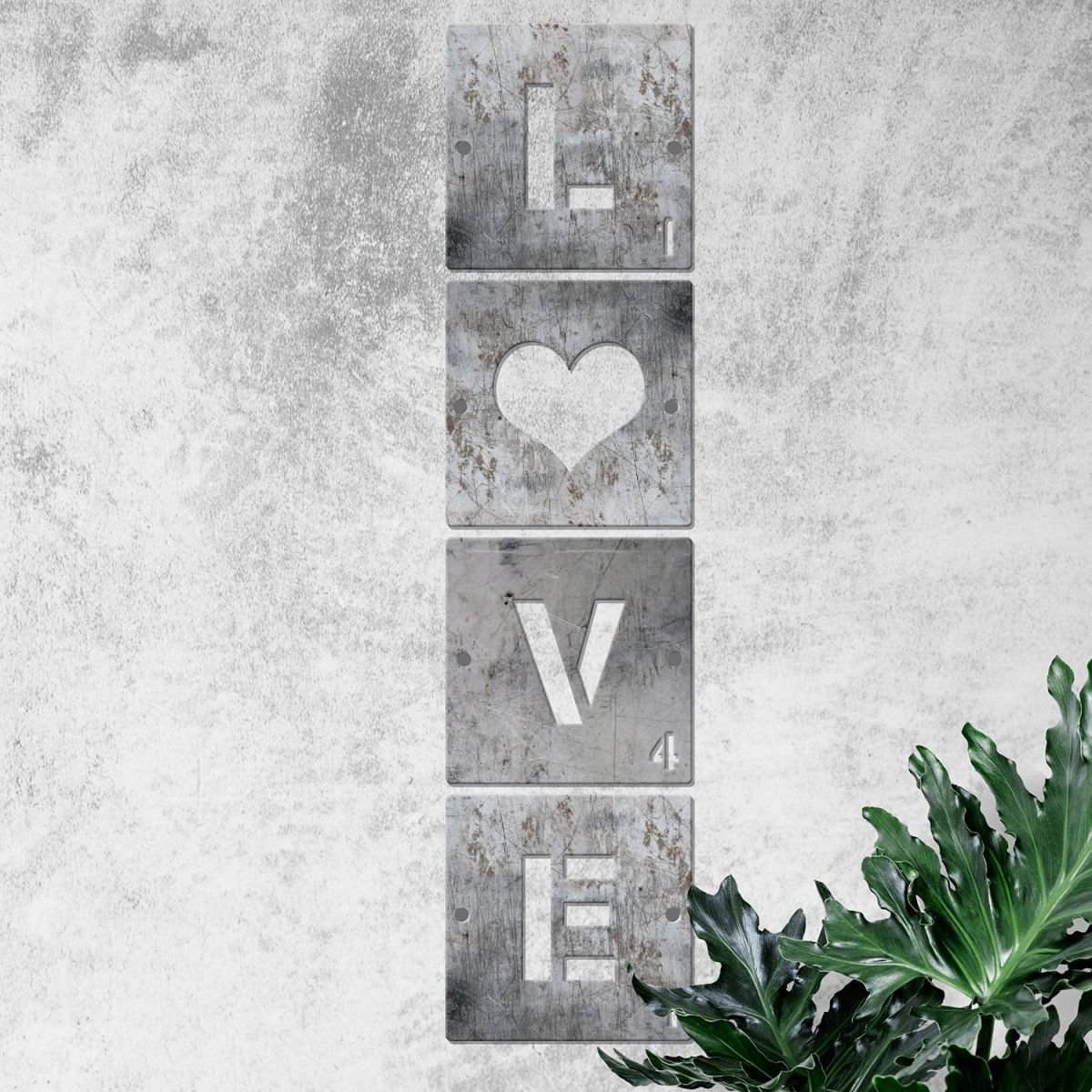 "LOVE" Scrabble Square Letters on a Rustic Grey Wall