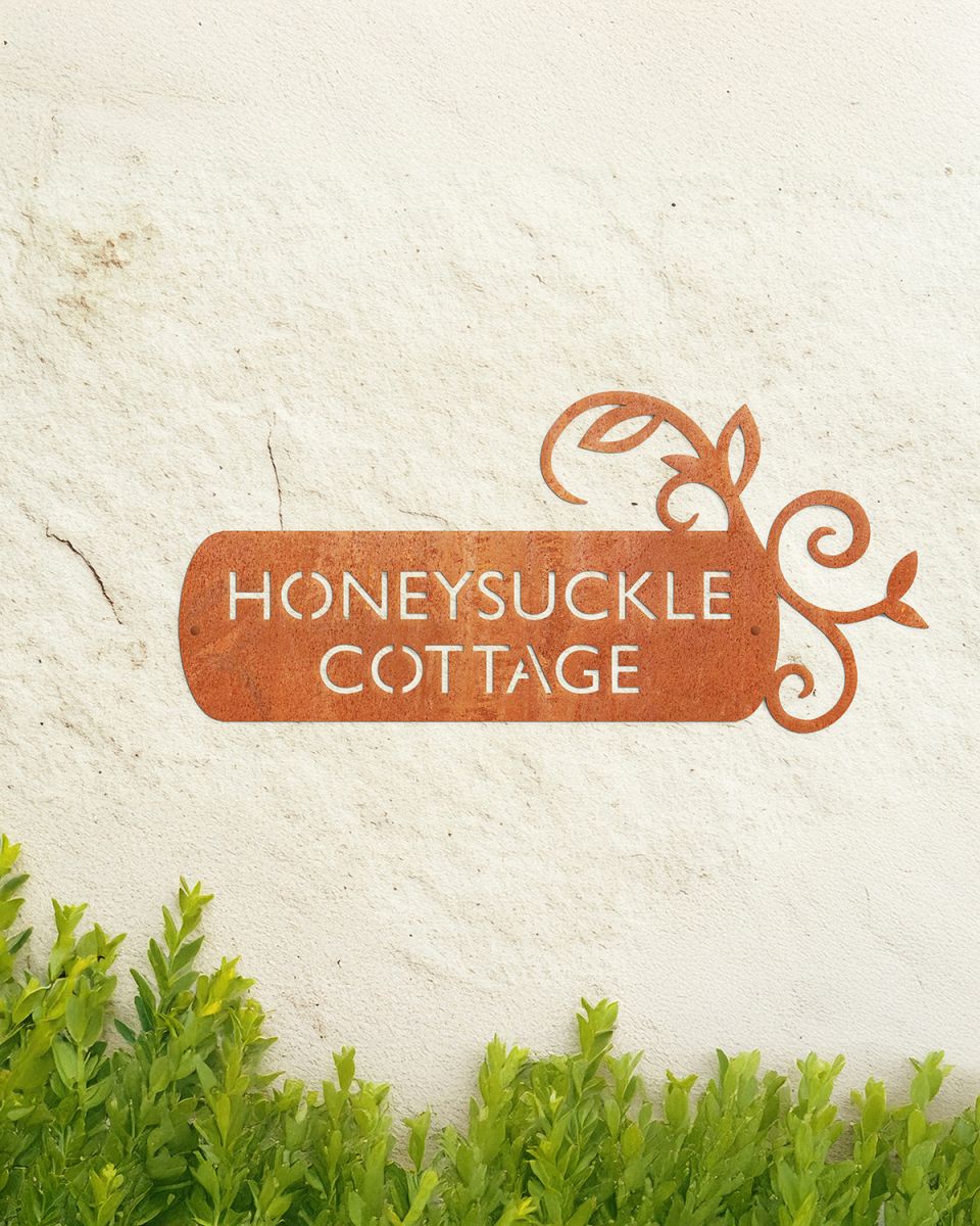 "Lovestone" Corten Steel House Name Sign in Situ on a Painted House Wall