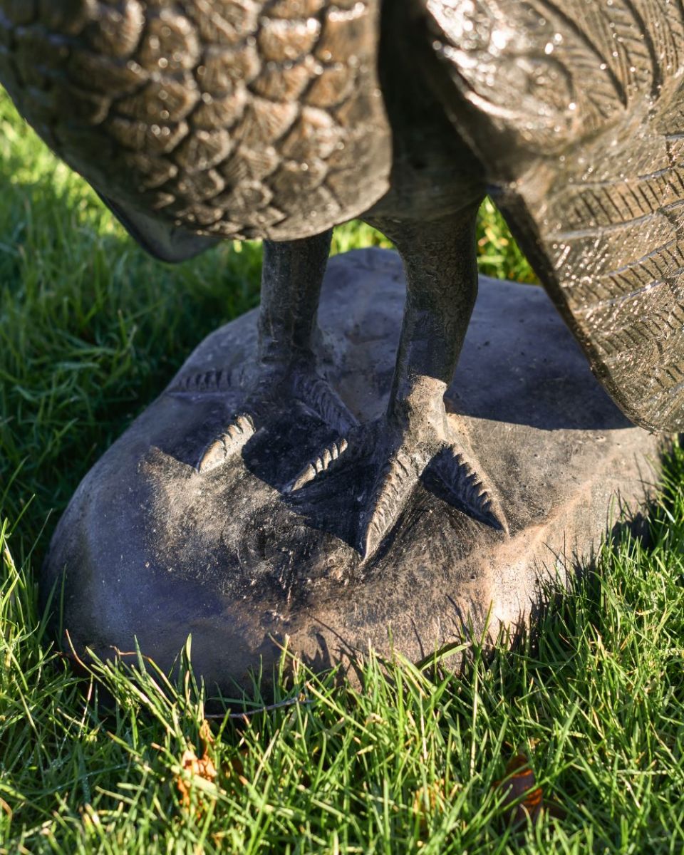 Close up of Bronze "Lurkey" Turkey Flower Planter feet