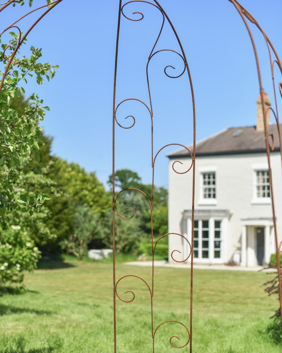 Close up of intricate scrollwork on garden gazebo Close up of intricate scrollwork on garden gazebo