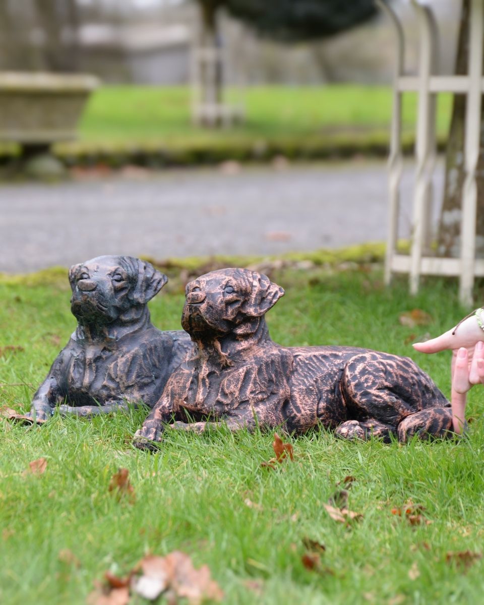 "Barney" the Labrador Cast Iron Garden Sculpture - Verdigris lying down next to copper version