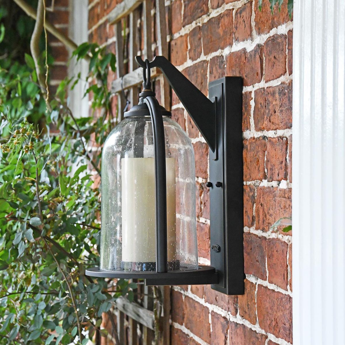 Side View of the "Maine" Traditional Bronze "Candle Stye" Lantern Mounted on a Brick Wall