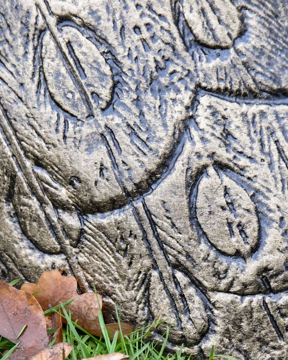 Close-up of the Feather Pattern on the Wings of the Majestic Peacock Sculpture
