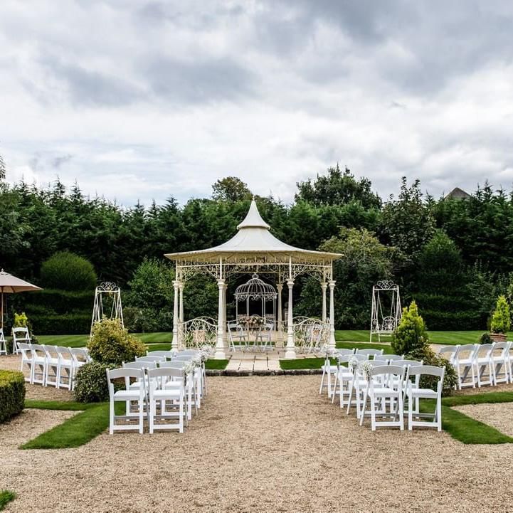 "Lady Leticia Dream Carousel" Bandstand Pavilion in Cream at the End of a Garden - Manor By The Lake  "Lady Leticia Dream Carousel" Bandstand Pavilion in Cream at the End of a Garden - Manor By The Lake