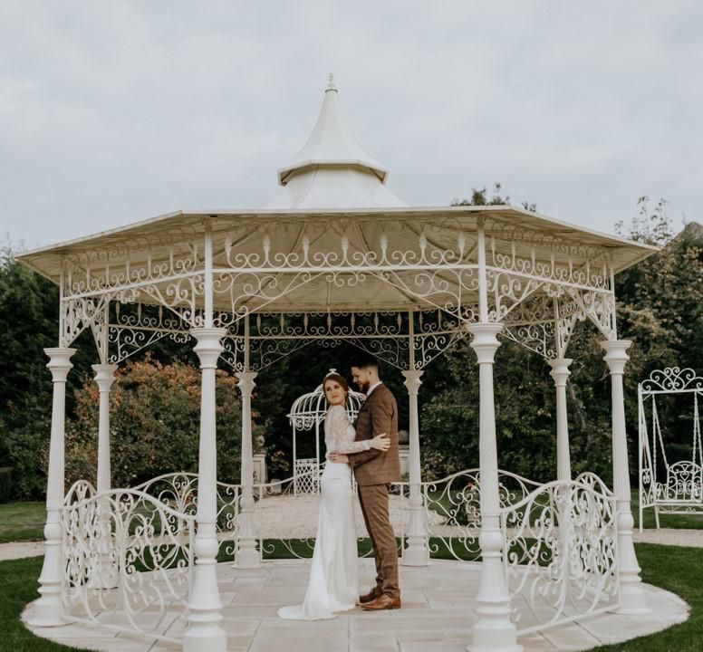 Customer photograph of the "Lady Leticia" Bandstand Gazebo in Use - Manor By the Lake