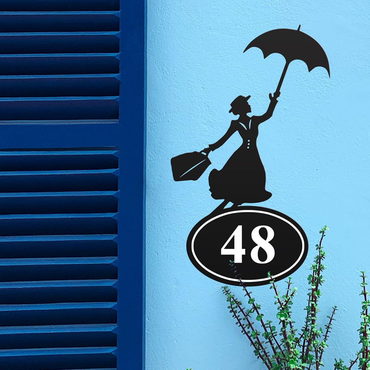 Mary Poppins Iron House Number Sign in Situ on a Blue Wall 