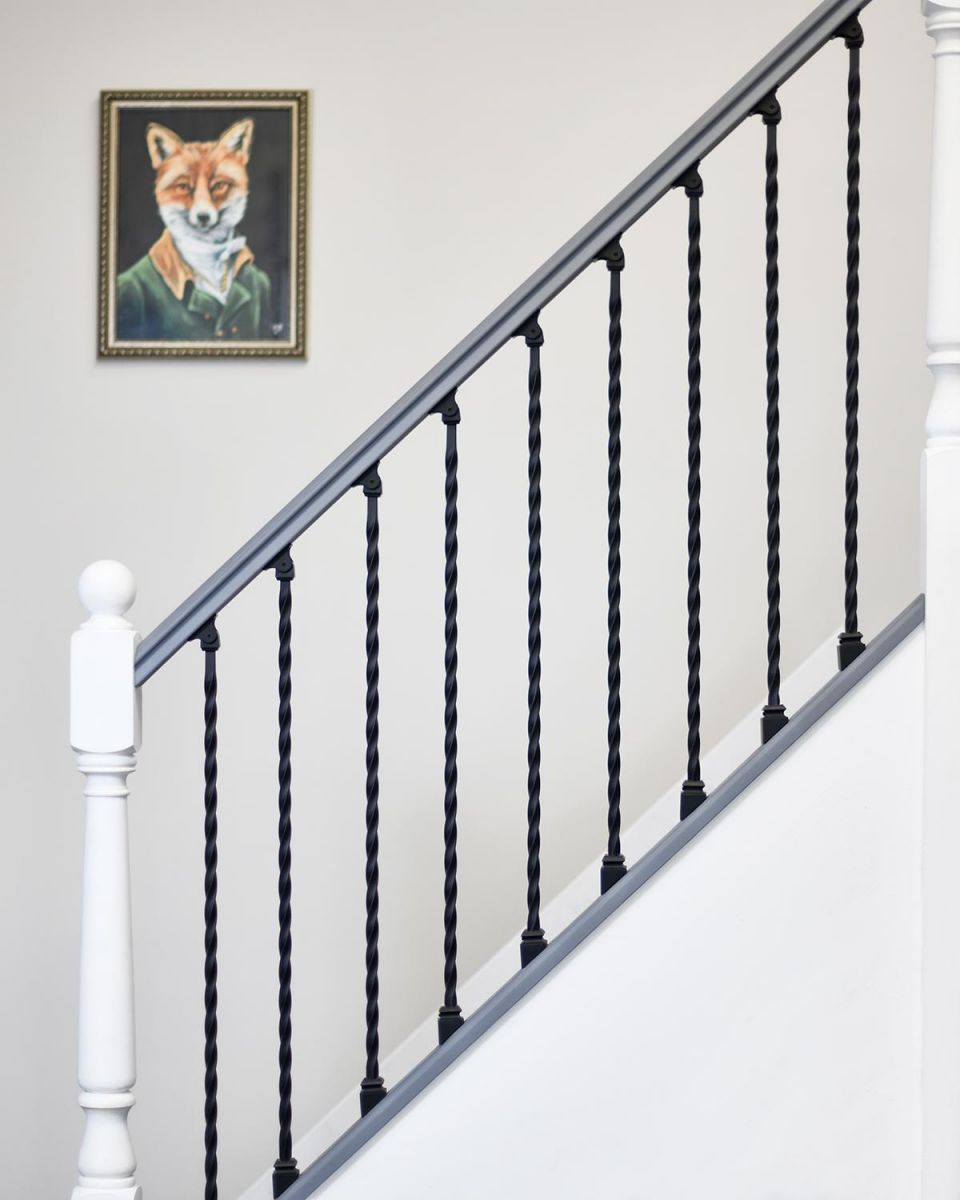 Matte Black "Enfield" Rope Twist Stair Spindles in Use on a Staircase