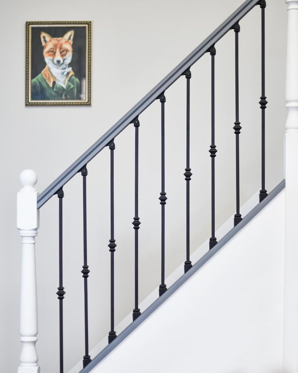 Matte Black "Enfield" Single Knuckle Stair Spindles in Situ in the Home