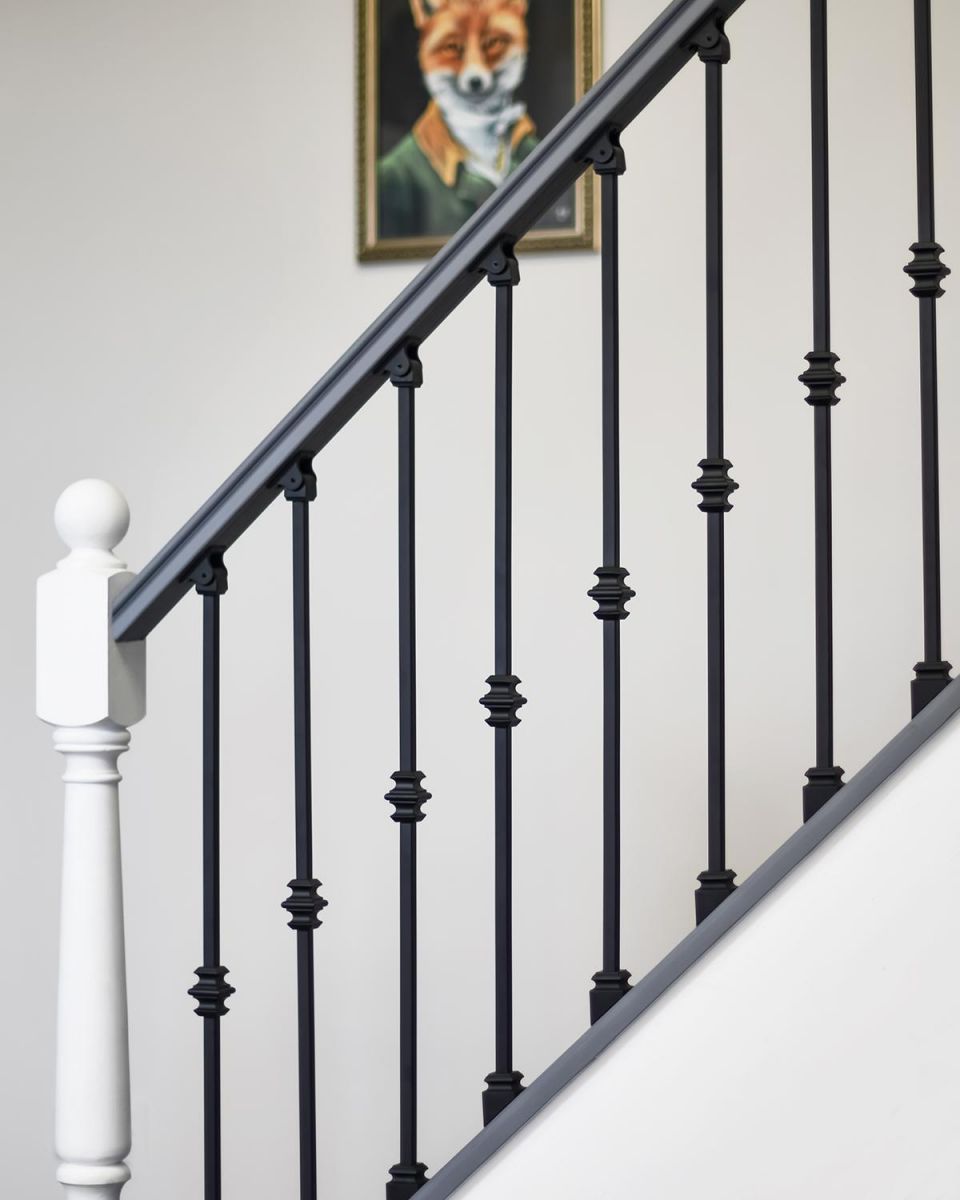 Matte Black "Enfield" Single Knuckle Stair Spindles in Situ