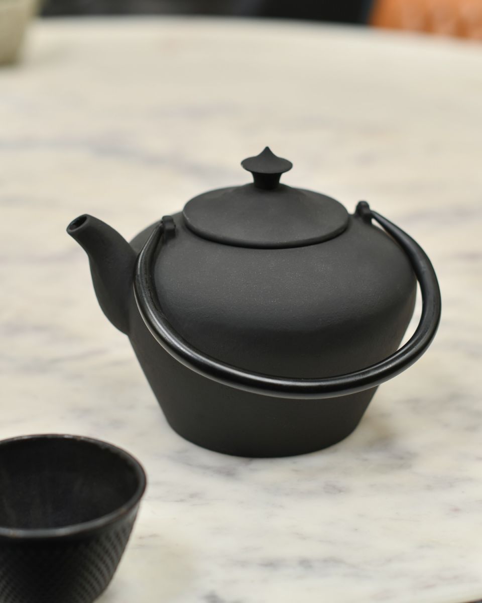 Matte Black Cast Iron Teapot with handles down Matte Black Cast Iron Teapot with handles down