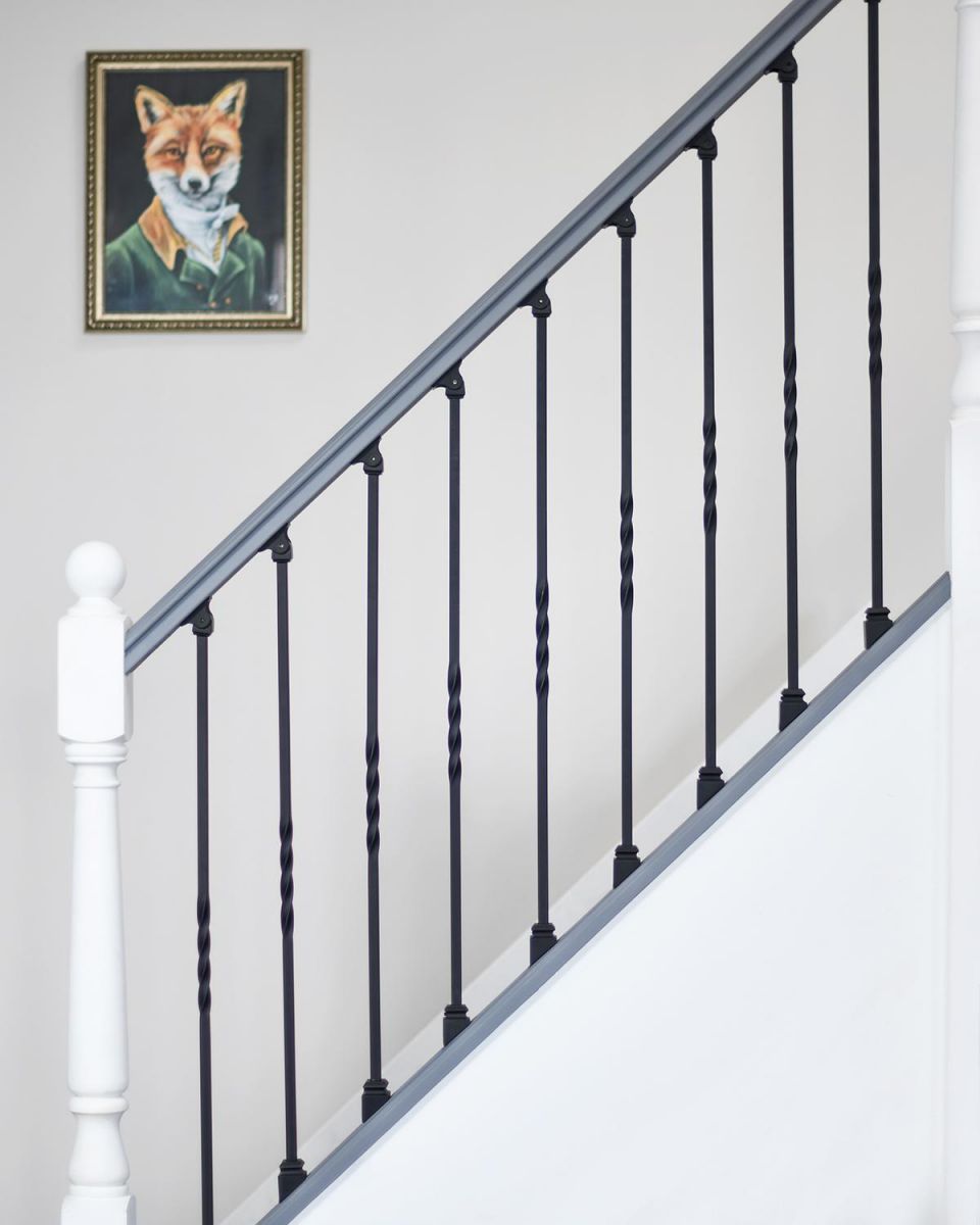 Matte Black "Enfield" Single Twist Stair Spindle in Situ in a Home