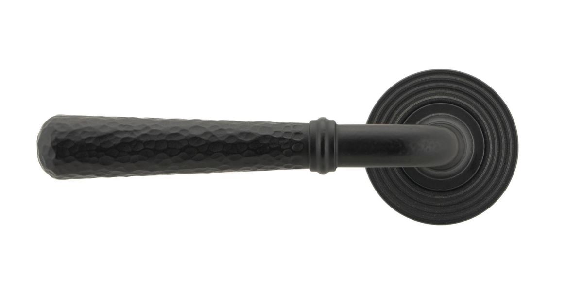 Matte Black Hammered Unsprung Lever Door Handle on Beehive Rose Front