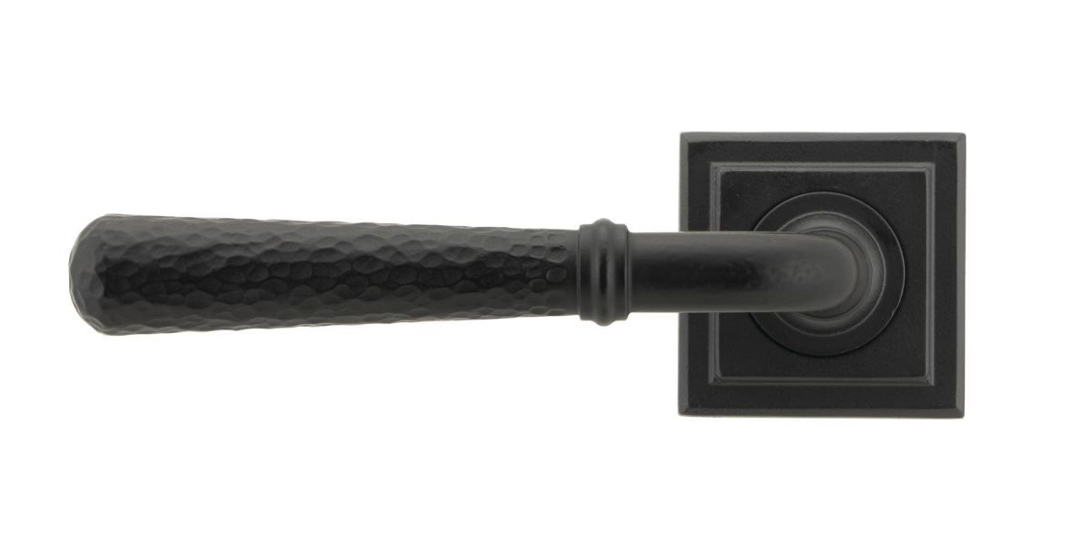 Matte Black Hammered Unsprung Lever Door Handle on Square Rose