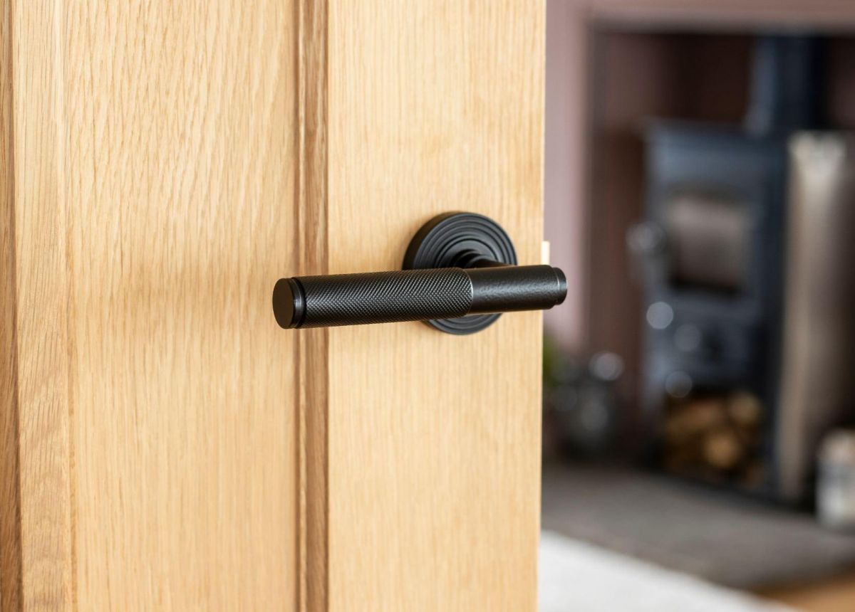 Matte Black Textured Unsprung Lever Door Handle on Beehive Rose on Door Matte Black Textured Unsprung Lever Door Handle on Beehive Rose on Door