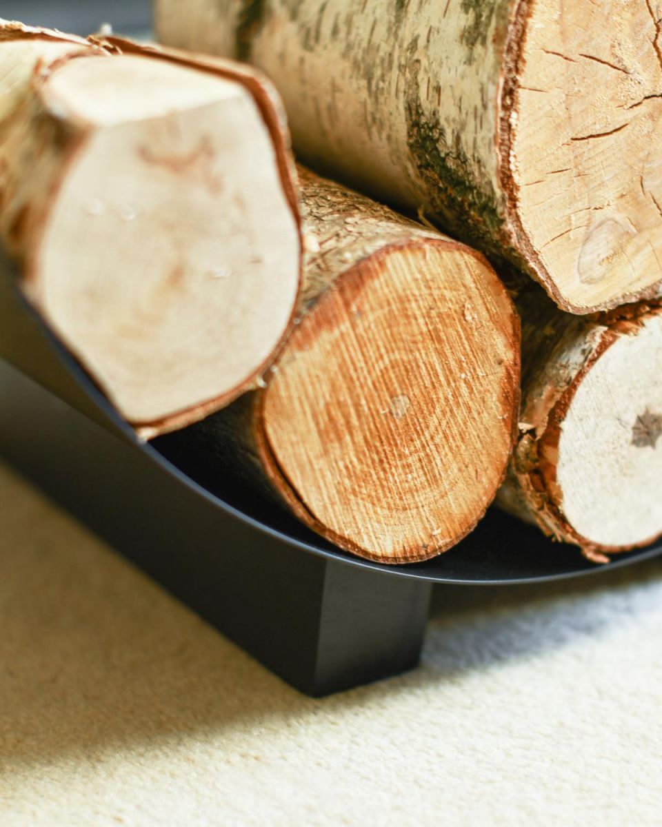 Close Up Of "Media Luna" Contemporary Log Holder In Use Close Up Of "Media Luna" Contemporary Log Holder In Use