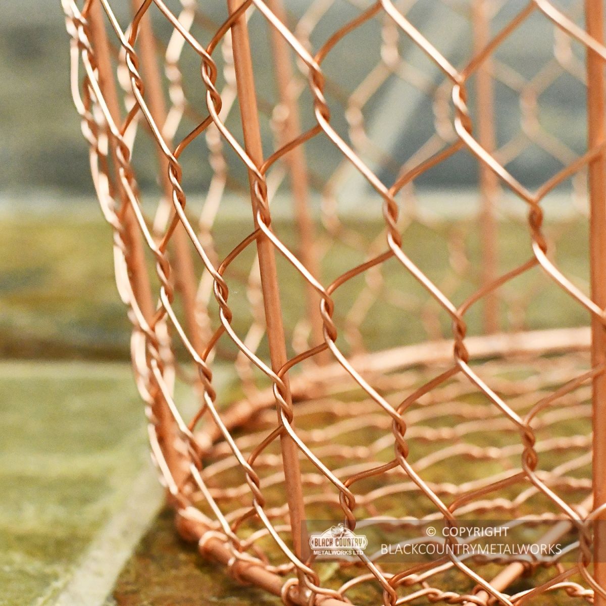 Close-up of the Bottom of the Rose Gold Wire Log Basket