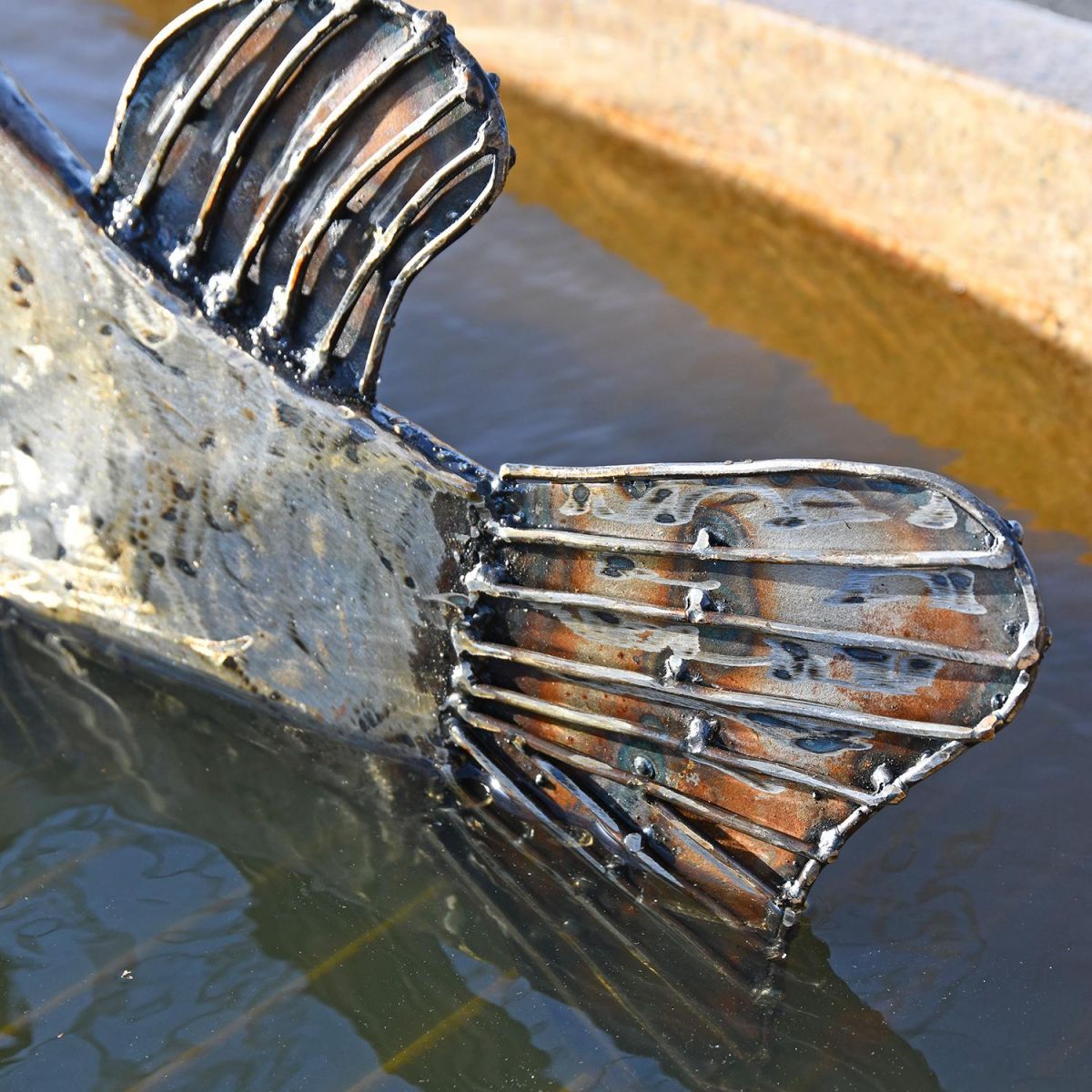 Close-up of the Tail on the Metal Swordfish Sculpture