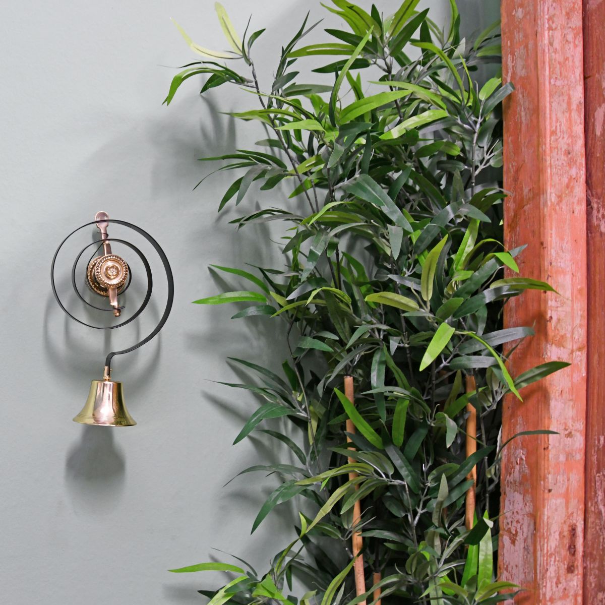 Polished Brass Traditional Butler Bell in Situ on Blue Wall