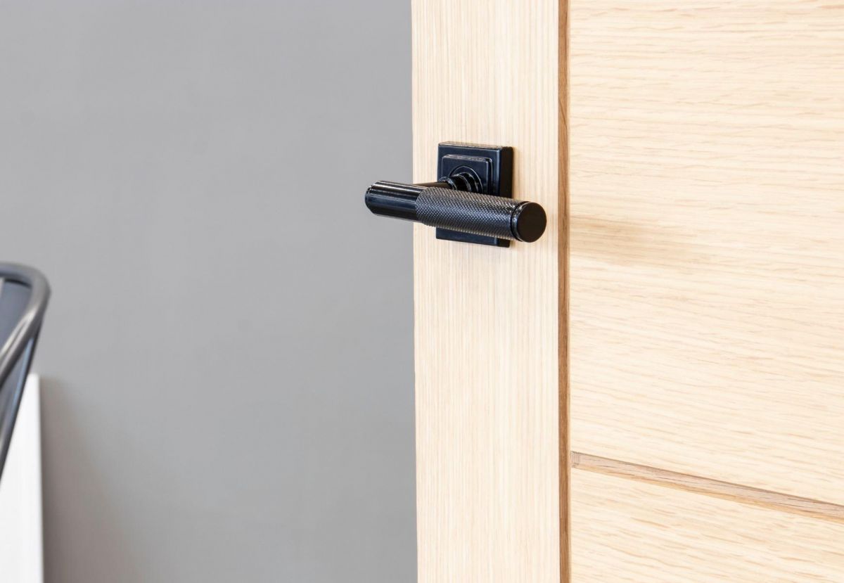 Midnight Black Textured Lever Door Handle on Square Rose in Situ