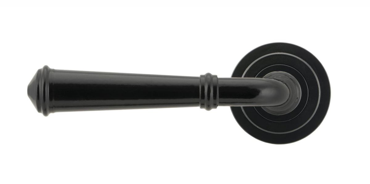 Midnight Black Unsprung Lever Door Handle on Art Deco Rose Front