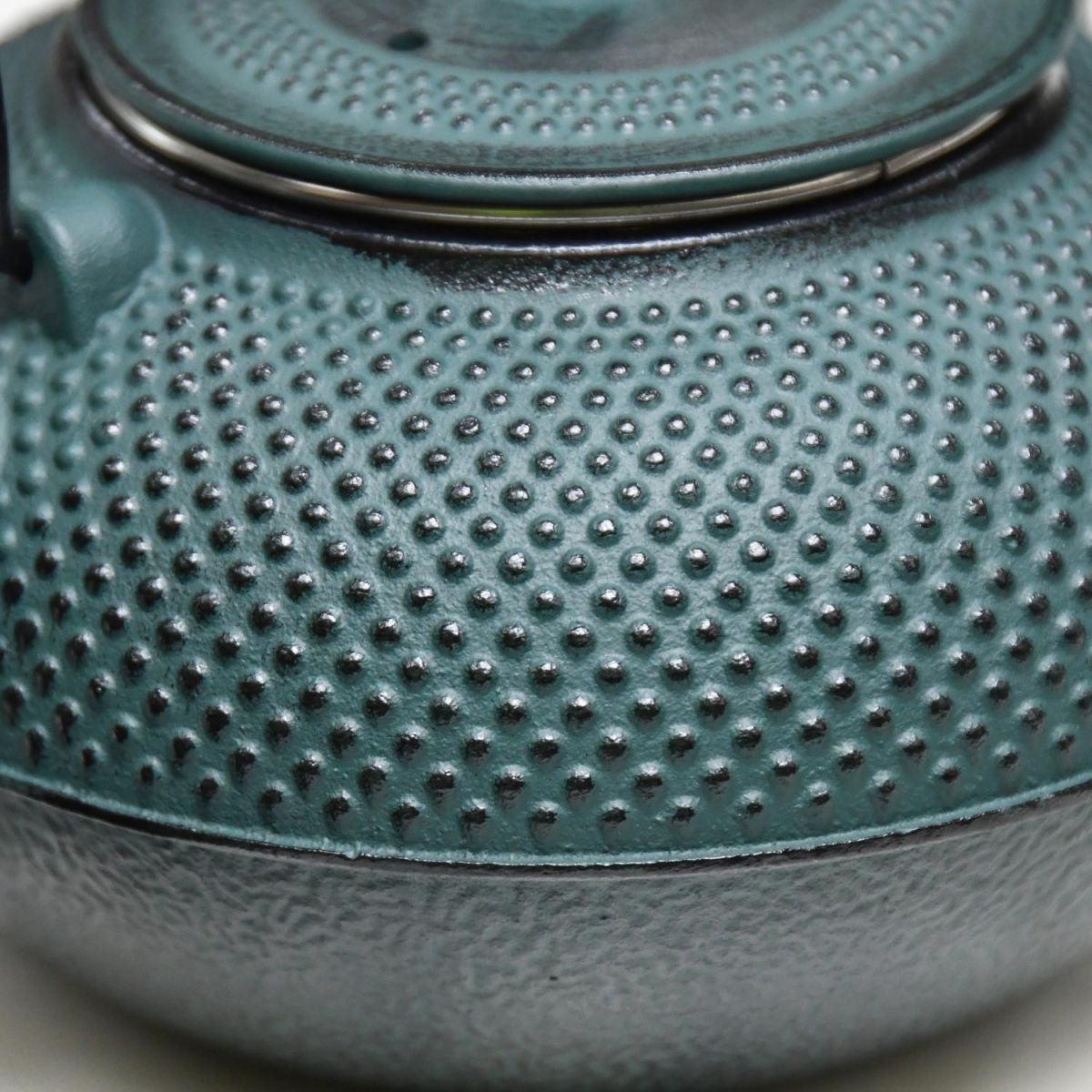 Close-Up of Dotted Pattern on Midnight Green Cast Iron Teapot 