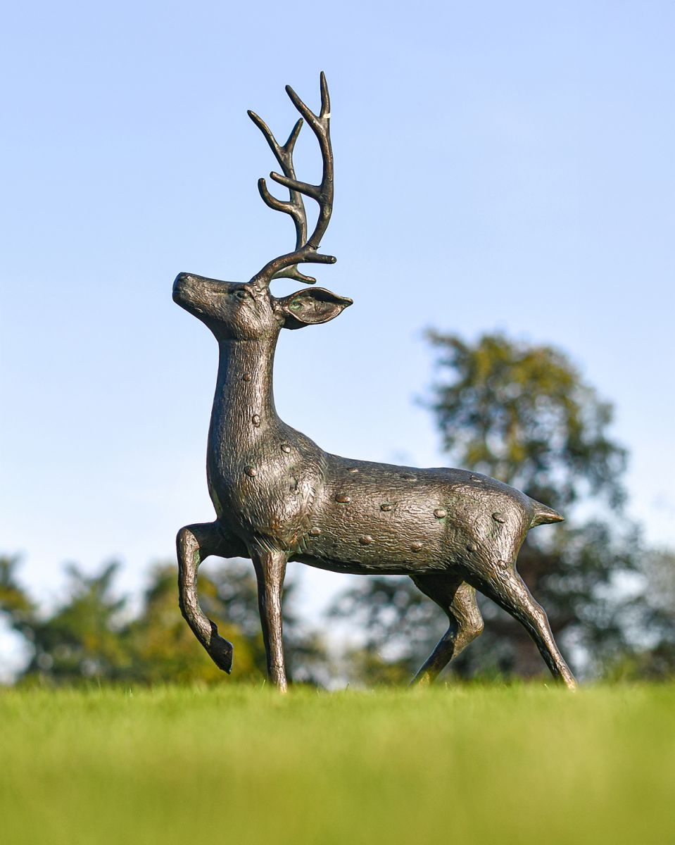 Miniature Aged Verdigris Stag Sculptures in Use outside in the Garden