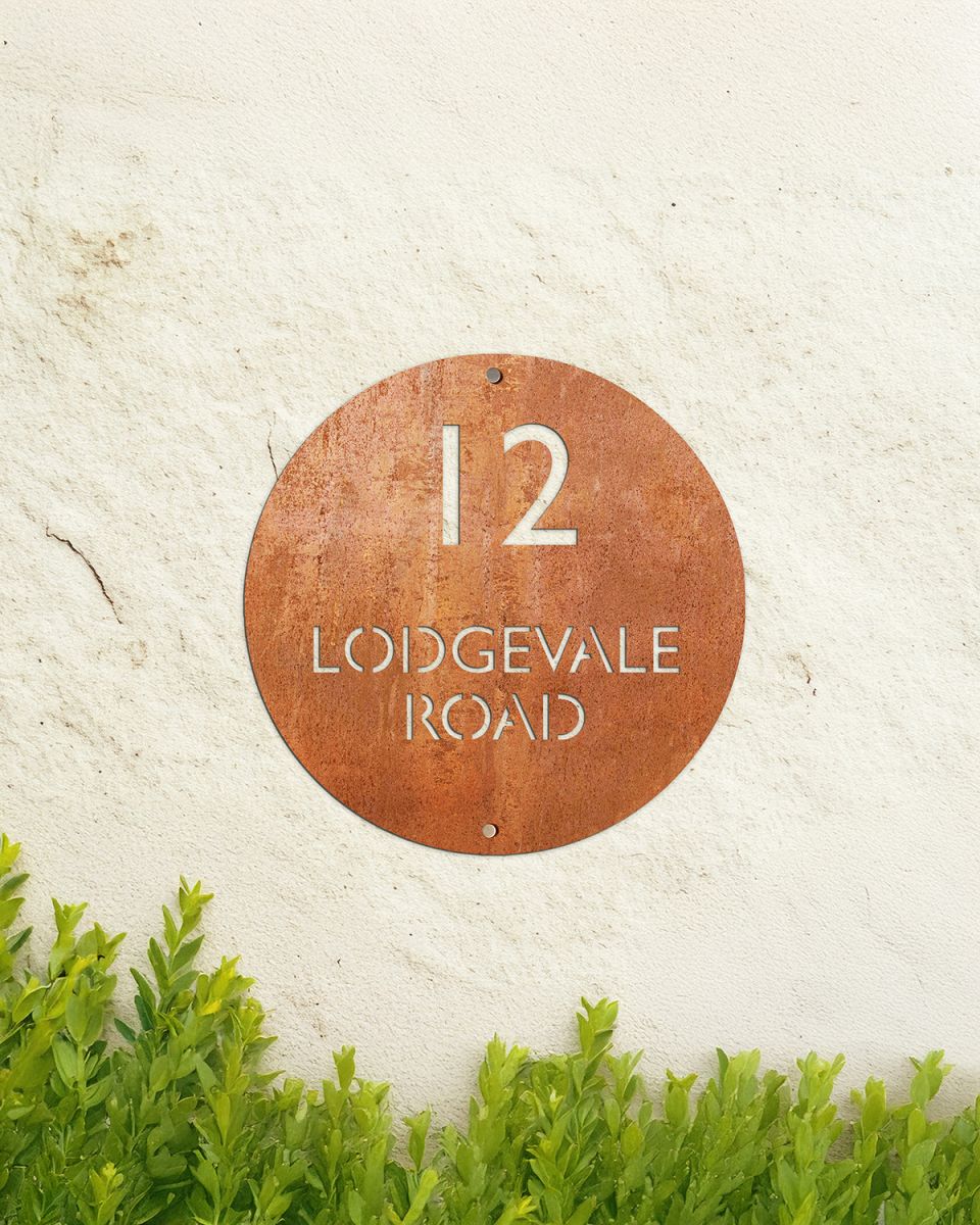 Modern Circular Corten Steel House Sign in Situ on the Front of a House