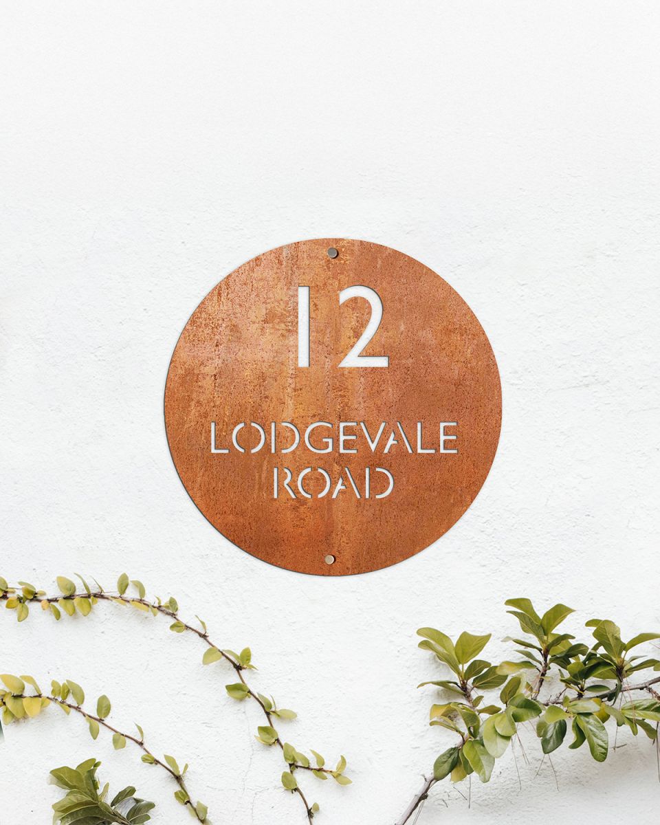 Modern Circular House Sign Created From Corten Steel