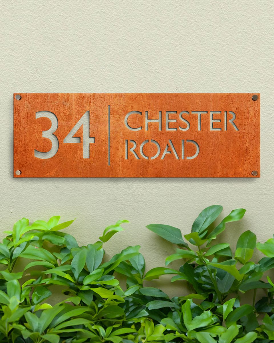 Corten Steel House Number Sign in Situ on a Modern Green Wall