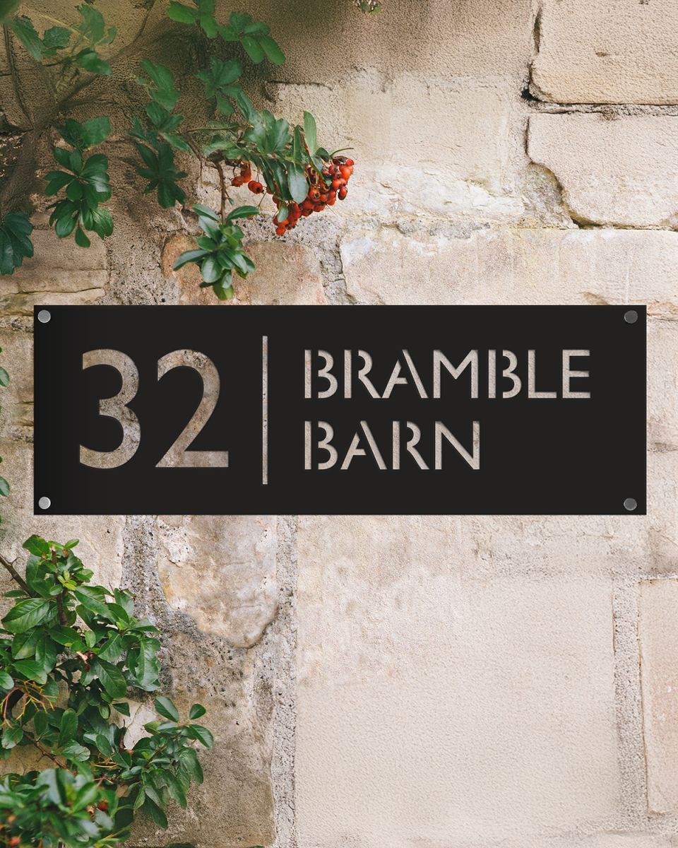 Modern Rectangular Steel House Number Sign on a Rustic Sandstone Wall  Modern Rectangular Steel House Number Sign on a Rustic Sandstone Wall