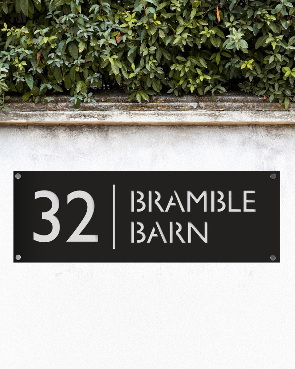 Modern Rectangular Steel House Number Sign in Situ on a Garden Wall  Modern Rectangular Steel House Number Sign in Situ on a Garden Wall